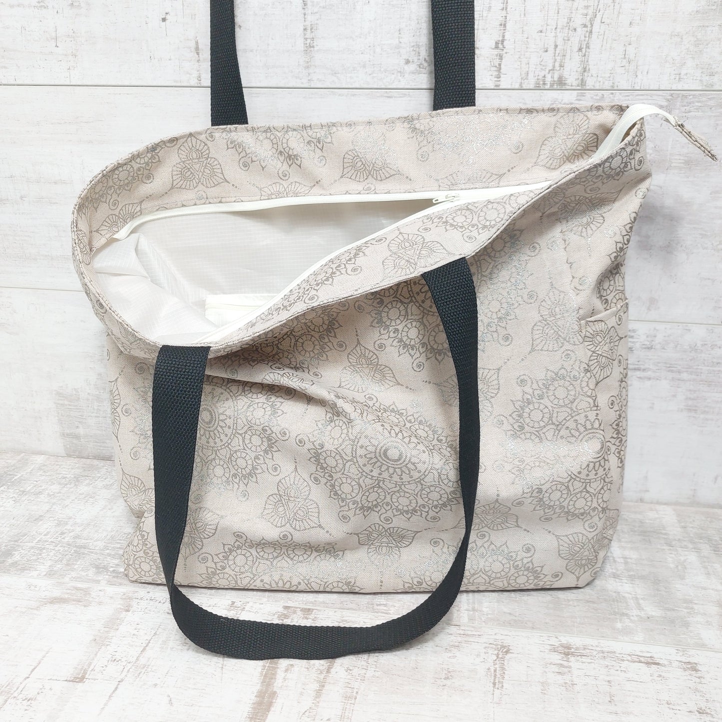 Multi pocket lined beach bag with secure zip fastening along the top. LAST ONE!