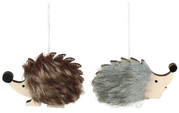 Two hanging hedgehog decorations with faux fur coats and wooden noses.