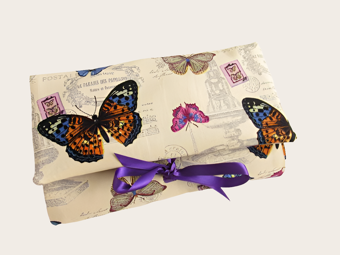 Front view of antique cream butterfly print makeup organiser.