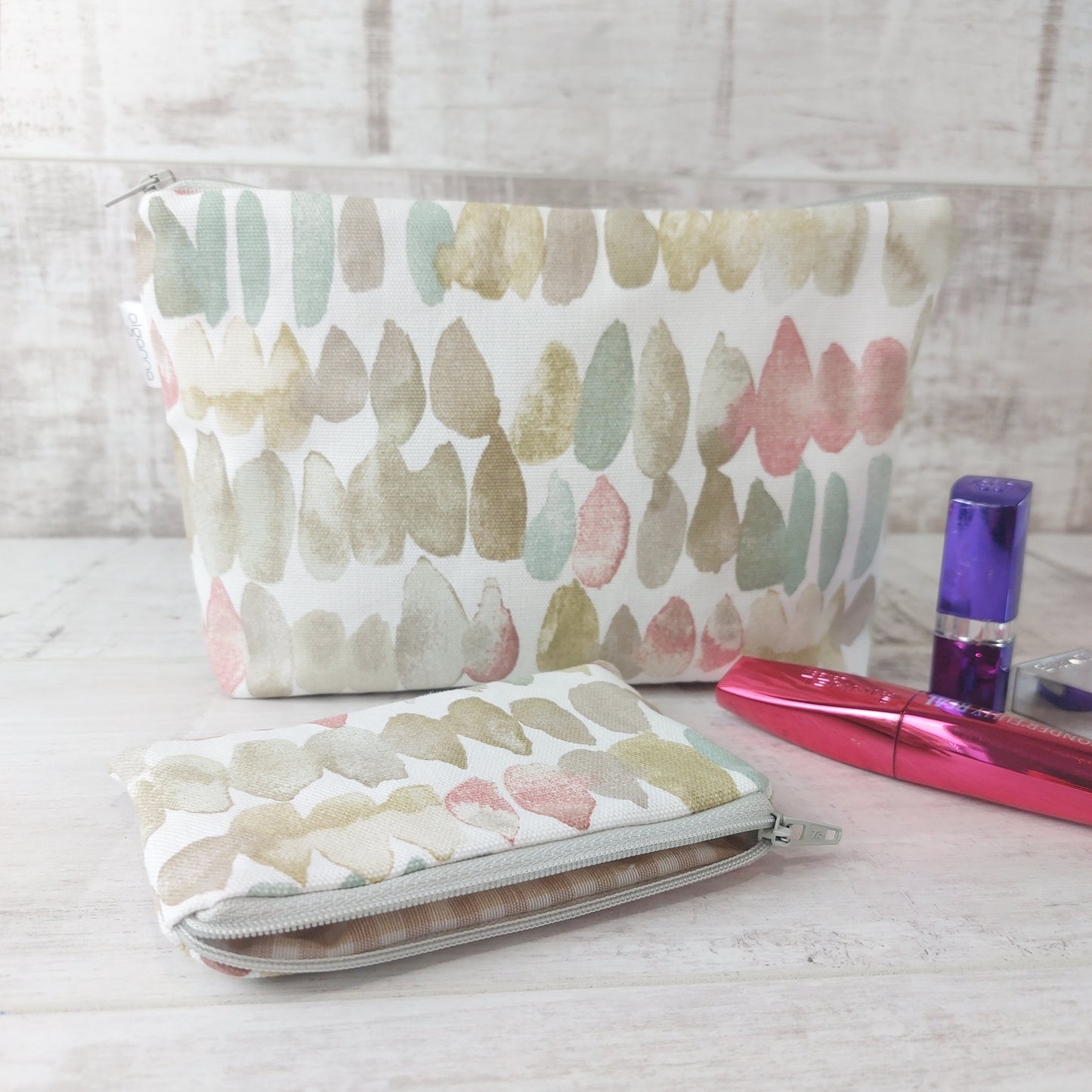 Natural stones print makeup bag and matching coin purse, pictured with beauty essentials.