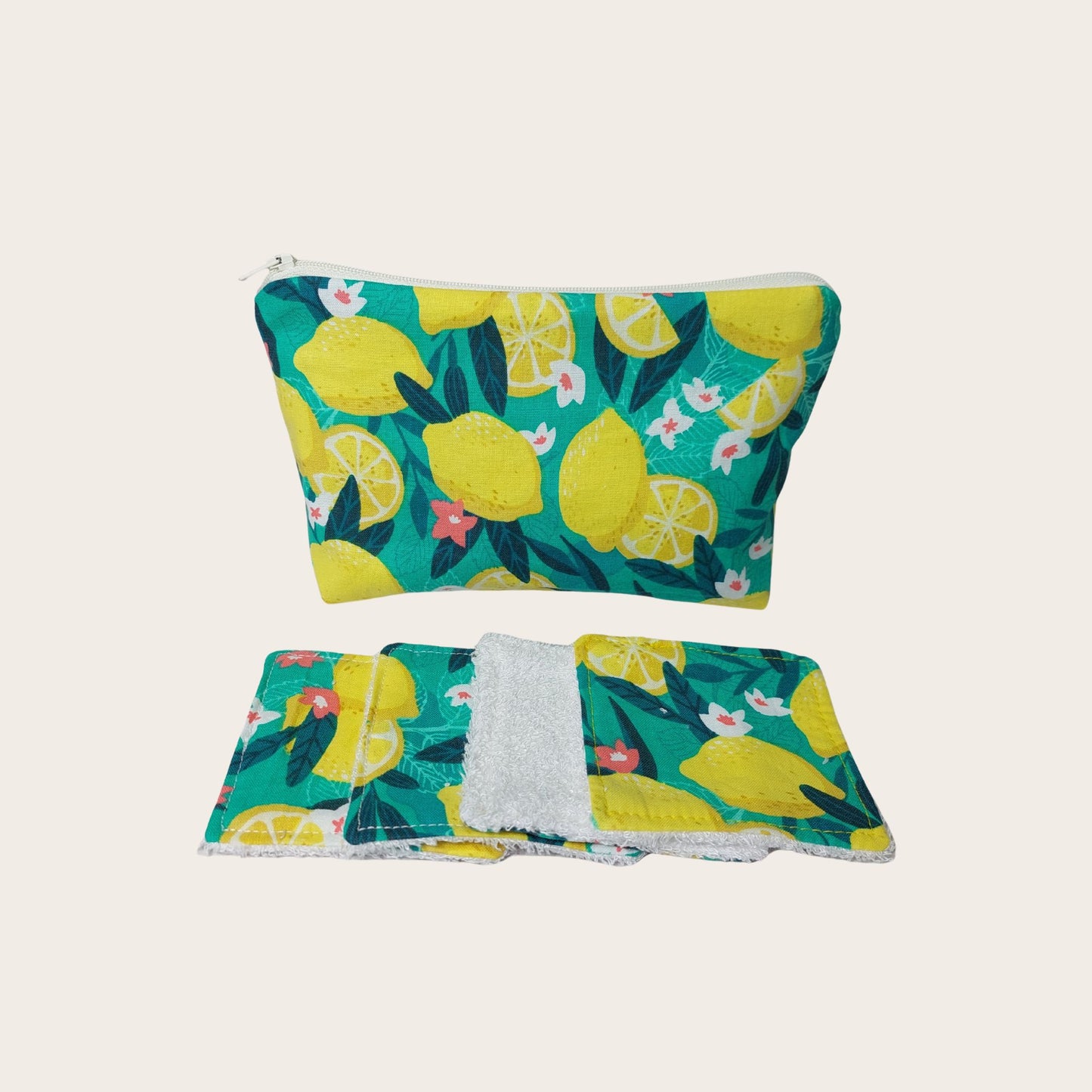 Makeup bag, front view, with four bamboo face wipes, in bold green and yellow Sicilian lemon print.