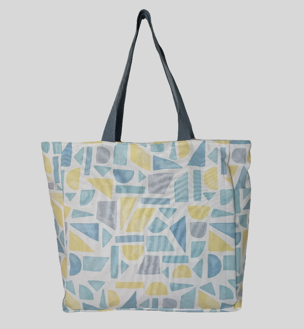 Front view of summery pastel print beach bag. 