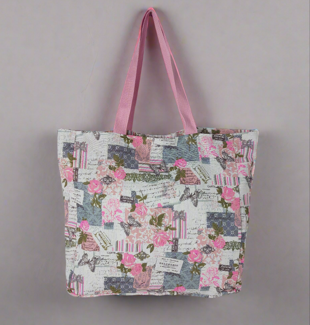 Front view of pink and grey vintage rose and butterfly print beach bag.