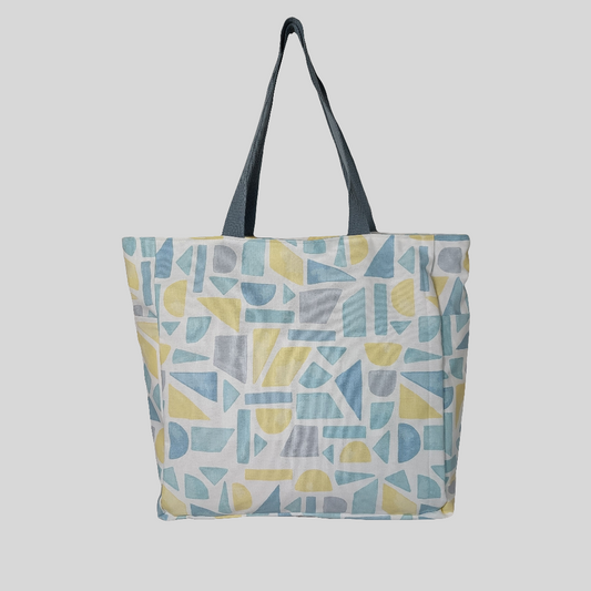 Front view of summery pastel print beach bag. 