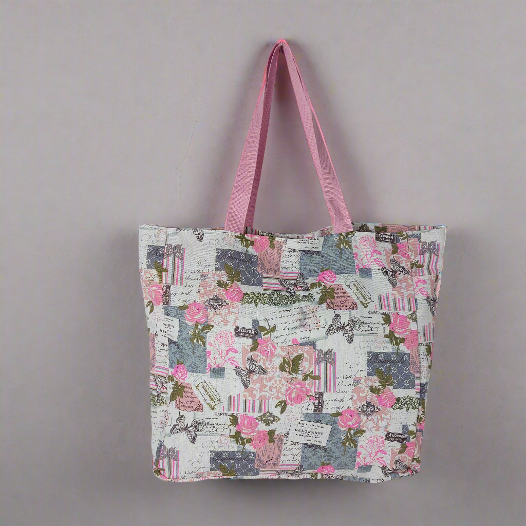 Front view of pink and grey vintage rose and butterfly print beach bag.