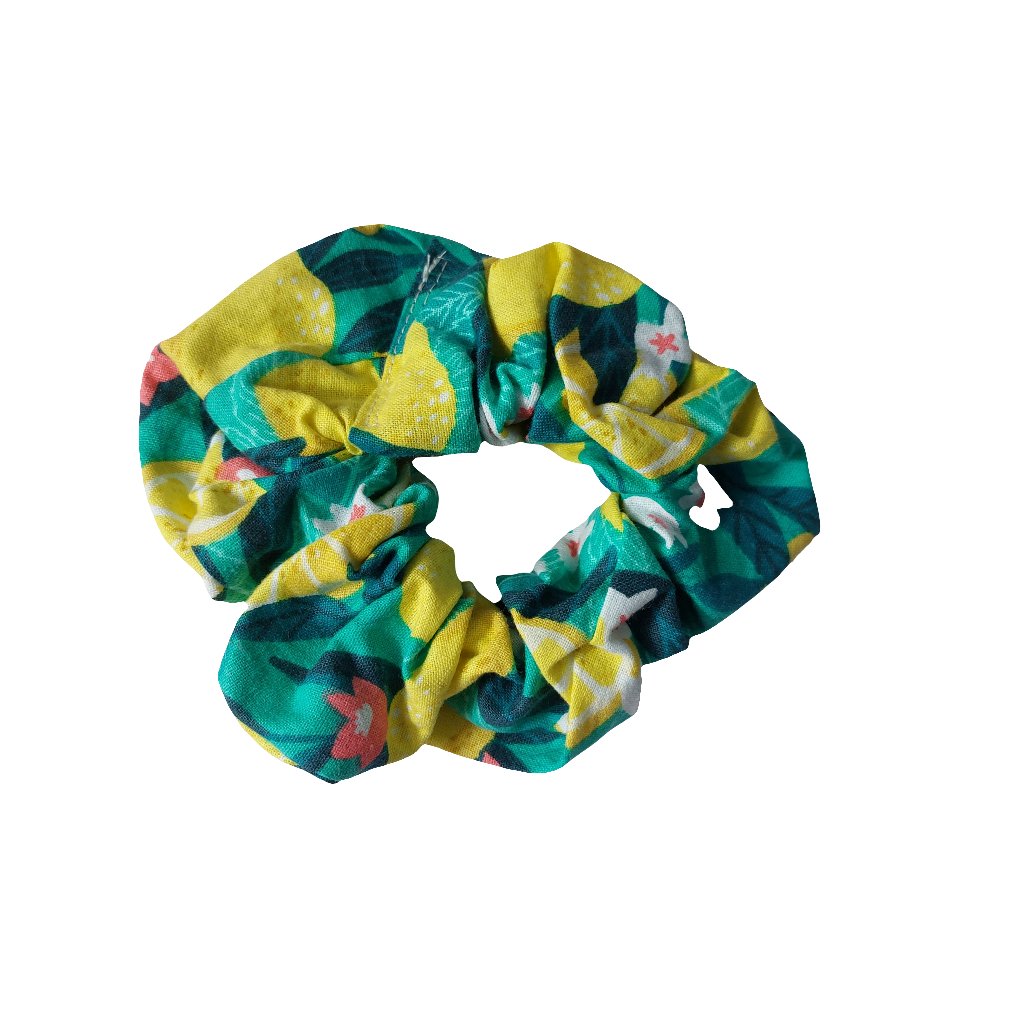 Top view of bold green and yellow Sicilian lemon print hair scrunchie.