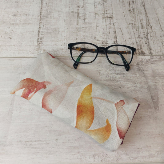 Autumn Leaves padded glasses case pictured with glasses.