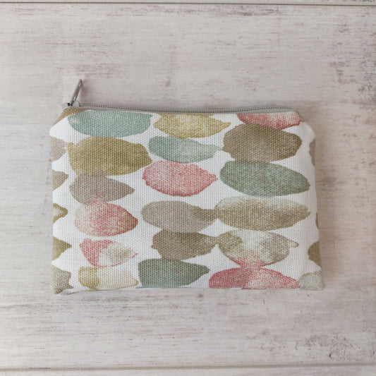 Neutral stone pebble print small zip pouch by Olganna.