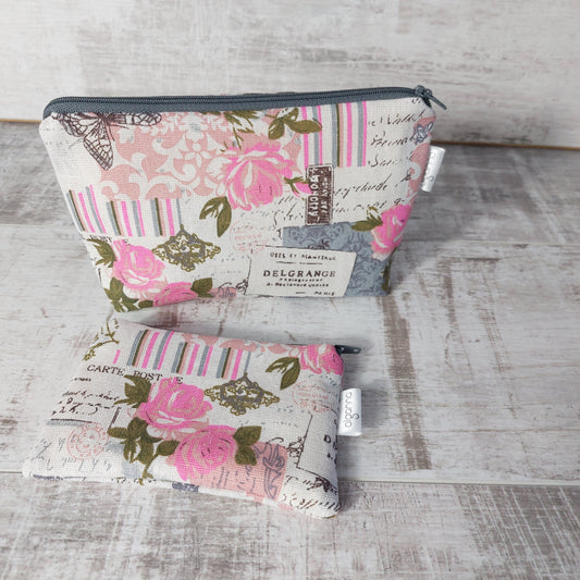 Pink and grey vintage rose and butterfly print makeup bag pictured with matching zip purse, each with an Olganna side label.