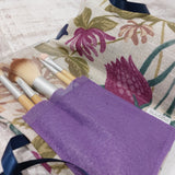 floral pattern make up bag with lilac coloured brushes pocket