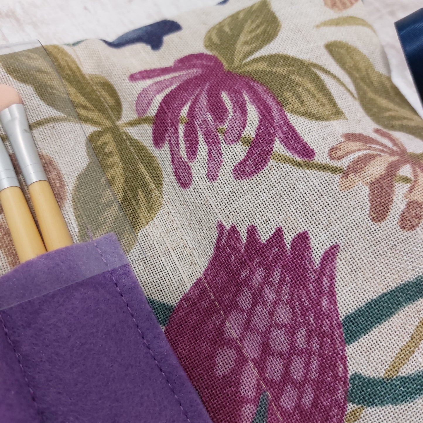 Close up on floral make up bag and brushes pocket