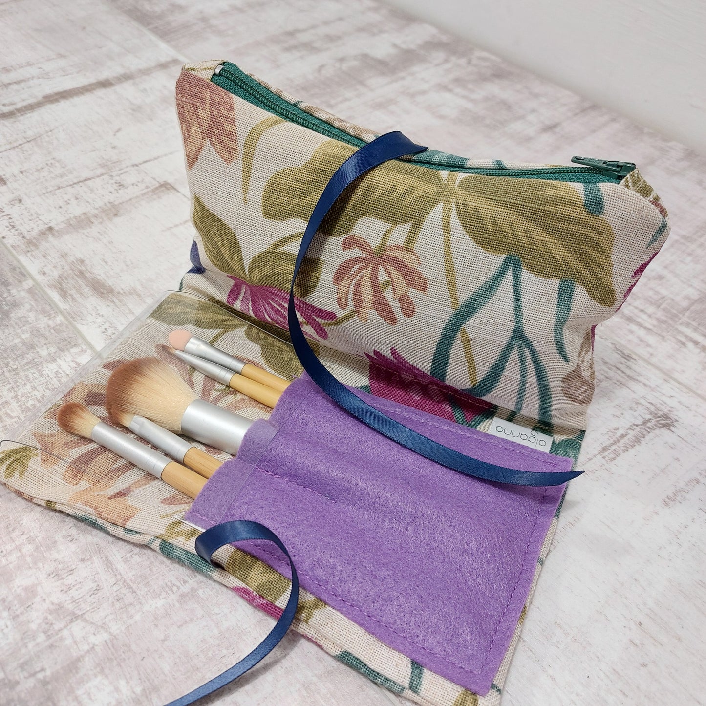 floral pattern make up bag with lilac coloured brushes pocket