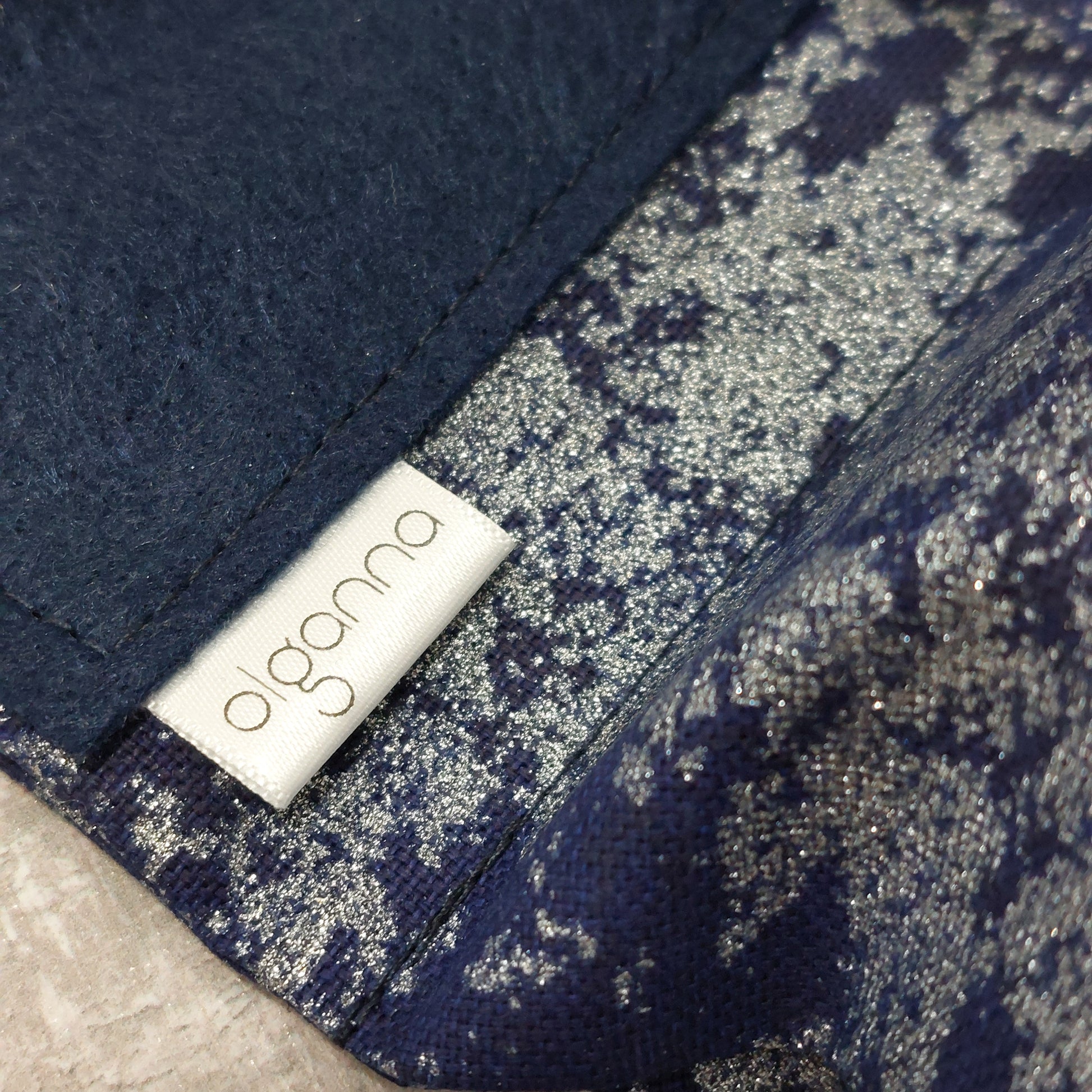 Close up of Olganna label on a navy background