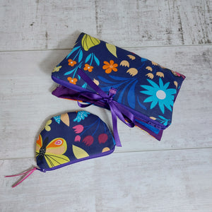 Floral bag and purse set with ribbon ties. Navy with bright colour pops and purple.