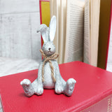 Grey Sitting Rabbit with a jute bow