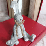 Grey Sitting Rabbit with a jute bow