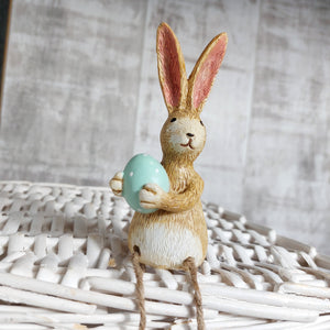 Rabbit Holding a pink egg with Dangly Legs