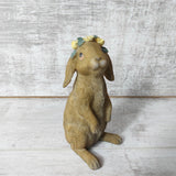 Flopsy Bunny wearing a crown of yellow flowers