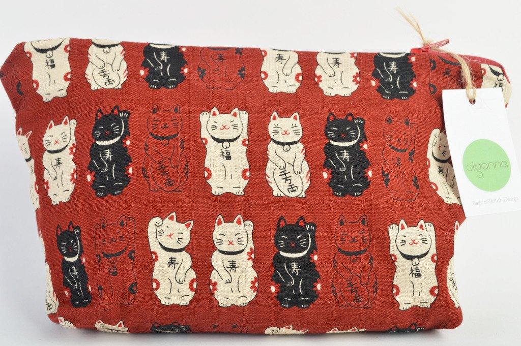 Red bag with all over print of waving cats. Cats are in black and cream to contrast against the red. Pictured with Olganna branded tag attached. 